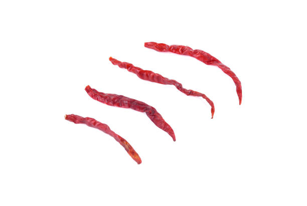 istock Dried red chili peppers isolated on white background 1667113246