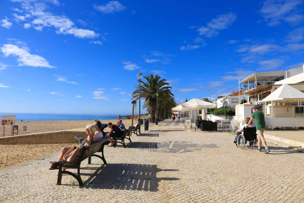 Beautiful cobblestone Promenade at Praia da Luz, Algarve Praia da Luz, Algarve, Portugal- October 20, 2022: Beautiful cobblestone promenade at Praia da Luz, Algarve, Portugal luz solar stock pictures, royalty-free photos & images