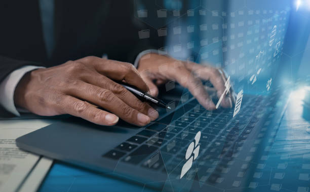 istock Business hand working on laptop computer with financial data and marketing growth report graph and data interface science. 1667151829