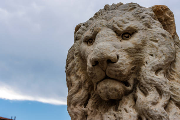Antique lion statue portrait in front of Saint George's Hall in Liverpool