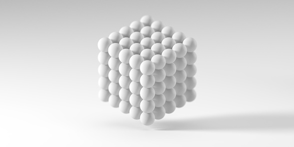 Abstract 3D background. 3D cube made of spheres against light grey background with shallow depth of field and copy space