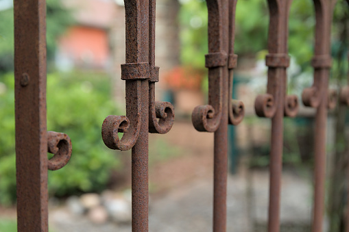 Retro metal fence decoration in the garden with bokeh background