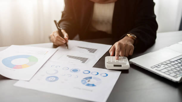 istock A professional businesswoman is analyzing business financial data on reports. 1667221801