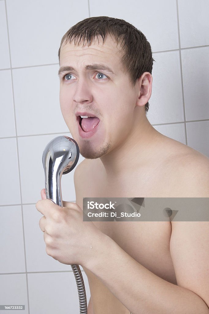 young man singing in the shower young attractive man singing in the shower Men Stock Photo