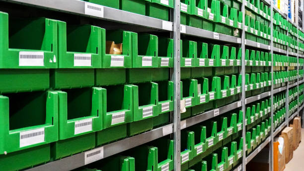 istock Green plastic boxes on a metal rack in the Storage Area 1667246276