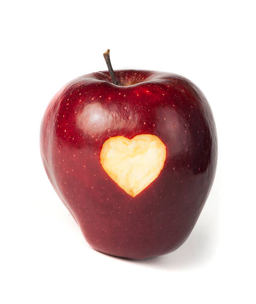 istock Heart shape closeup carved in apple 166725563