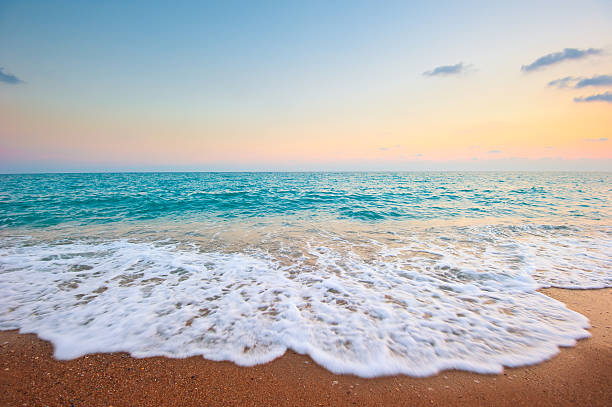 istock Splash of sea foam on a sandy beach 166727569