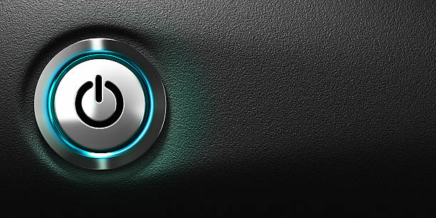 Computer Power Button pushed power button of a computer with blue light, black background with free space for text, horizontal banner format push button photos stock pictures, royalty-free photos & images
