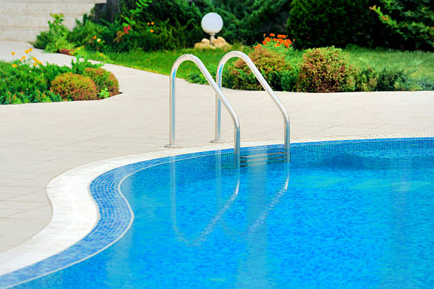 istock Swimming pool with stair at hotel close up 166730974