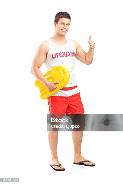 Happy Lifeguard On Duty Giving A Thumb Up Stock Photo - Download Image Now - Lifeguard, Cut Out, 20-29 Years