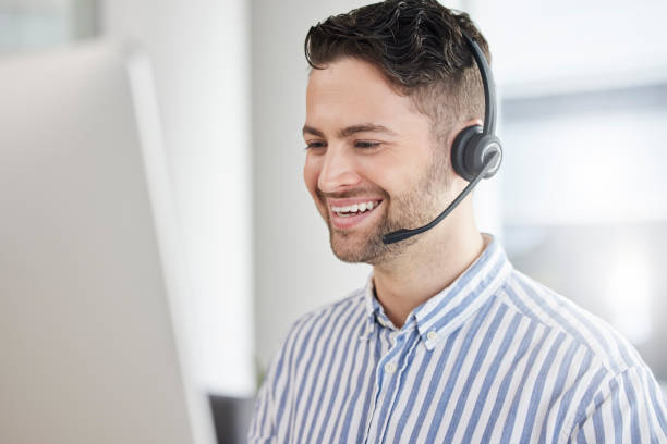 istock Customer service, call center and happy consultant or man speaking online for technical support, advice or help. Employee, talking and consulting person In Portugal working in crm for tech startup 1667315873