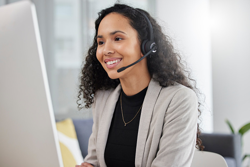 Customer service, call center and happy consultant or woman speaking online for technical support, advice or help. Employee, talking and consulting person In Brazil working in crm for tech startup