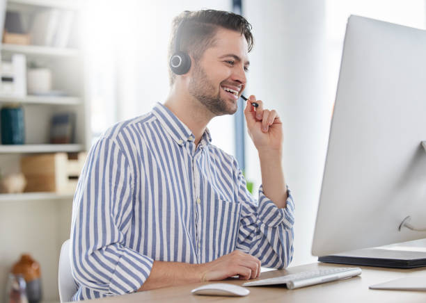 istock Happy, customer service and consultant or man in call center speaking online for technical support, advice or help. Employee, talking and consulting person in London working in crm for tech startup 1667317014