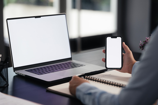 Minsk, Belarus - December 11, 2019 : New model apple iphone lies on laptop keyboard closeup. Illustrative editorial