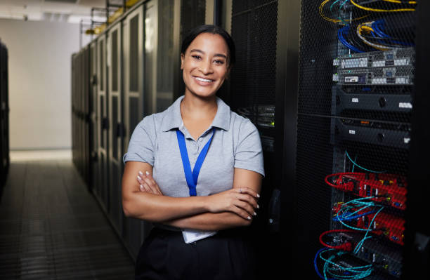 istock Server room, portrait or happy woman technician for online cybersecurity update or machine system. IT support data center, smile or proud engineer fixing network for information technology solution 1667364799