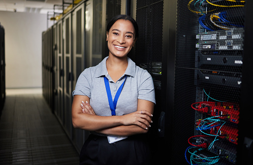 Server room, portrait or happy technician for online cybersecurity update or machine system. IT support data center, smile or proud woman engineer fixing network for information technology solution