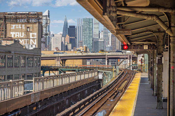 Queensboro Plaza Subway Station, Queens, New York, USA - August 18th 2023:  View to Manhattan skyline from a elevated subway station