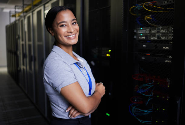 istock Server room, portrait or woman engineer for online cybersecurity glitch, machine or servers system. IT support, smile or happy woman fixing network for information technology solution in data center 1667372311