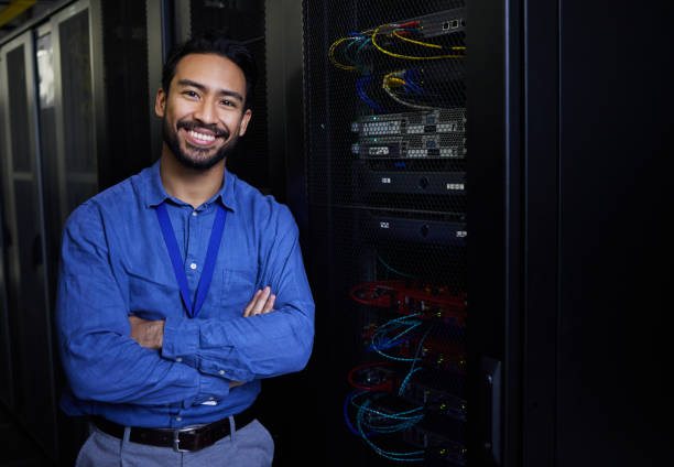 istock Server room, portrait or happy male developer for online cybersecurity glitch or machine system. IT support, smile or proud engineer fixing network for information technology solution in data center 1667372318