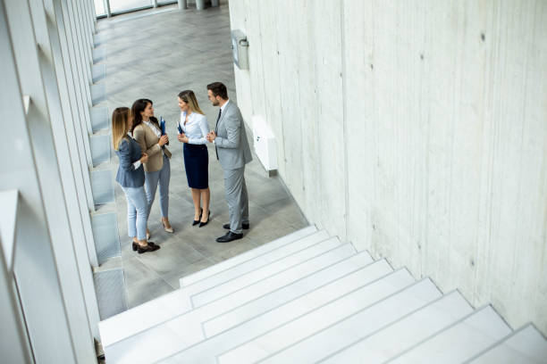 istock Young startup team have a discussion by stairs in the office corridor 1667374492