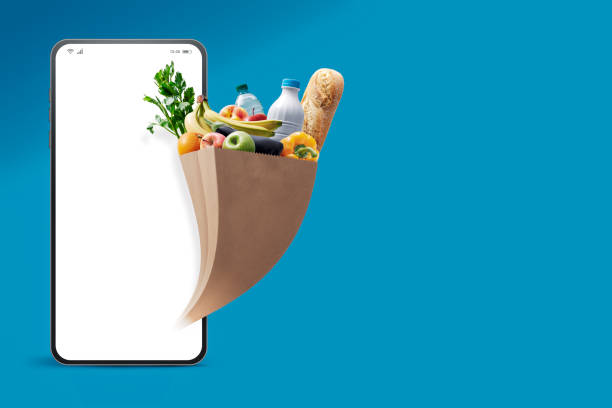 istock Grocery bag and blank smartphone 1667375565