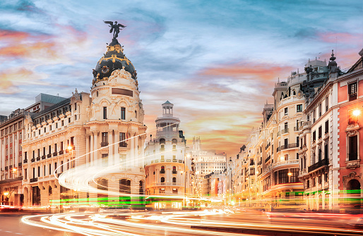 Madrid cityscape at sunset - Traffic lights in Gran Via - Spain