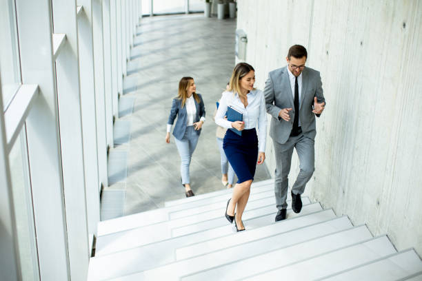 istock Young startup team have a discussion while climbing on  stairs in the office corridor 1667380940