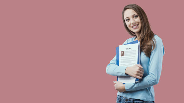 istock Young woman holding her resume 1667390053