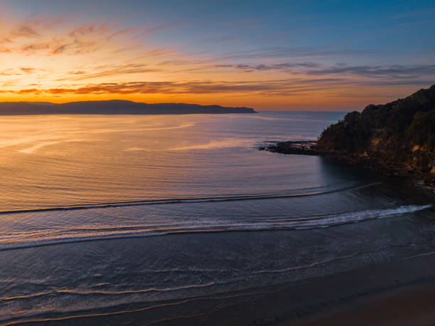 istock Pretty sunrise at the seaside with high cloud and low tide 1667396836