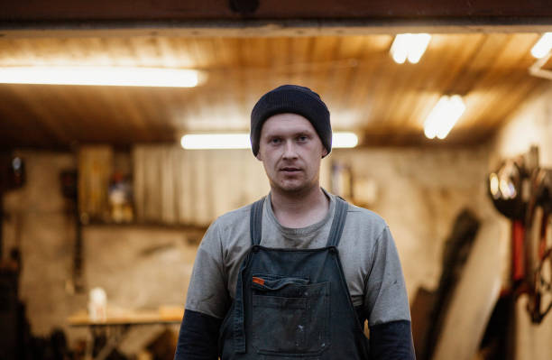 istock male master mechanic against the backdrop of a garage workshop in work clothes 1667415030