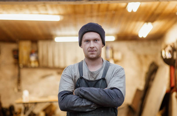 istock male master mechanic against the backdrop of a garage workshop in work clothes 1667415031
