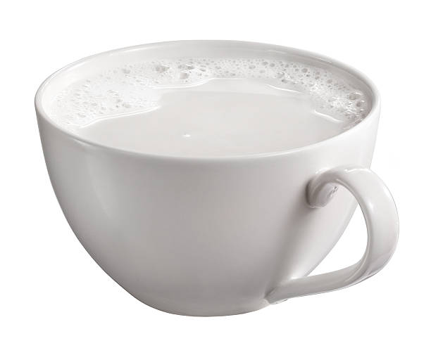 a cup of milk isolated on white background a cup of milk with cream and bubbles isolated on white background with clipping path CUP OF MILK stock pictures, royalty-free photos & images