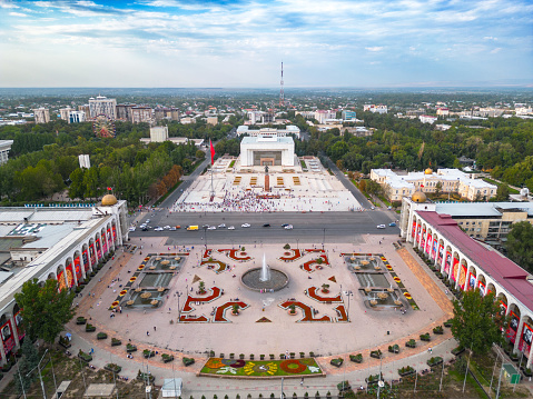 Bishkek, Kyrgyzstan - July 15, 2023: Aerial view of Bishkek city's Ala-Too central square with waving flag