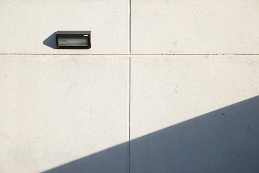 Lamp in a concrete wall