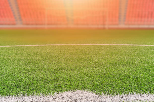 istock Empty football field evening sunset 1667470638