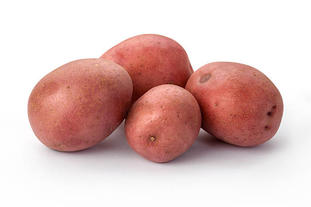 Four Fresh Red Potatoes in a Group isolated