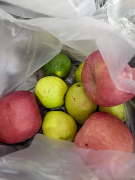 istock various types of fruit in white plastic bags 1667507860
