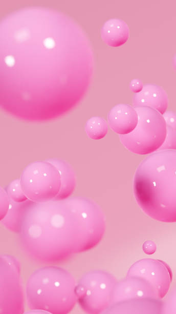 istock Pink shiny balls on peachy background 1667528404