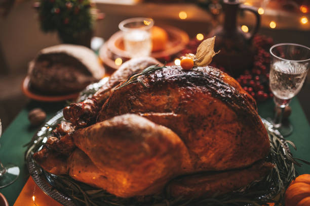 istock Thanksgiving holiday dinner table setting with fall decoration and pumpkins 1667537004
