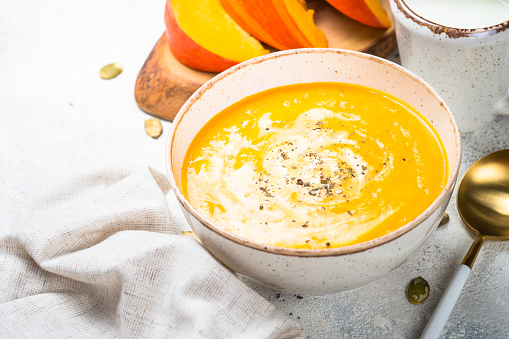 Traditional Autumn Pumpkin Soup in a Clay Bowl