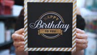 istock gift box. Happy birthday. close-up. elegant gift box with a congratulatory inscription. Gift for birthday. 1667559233