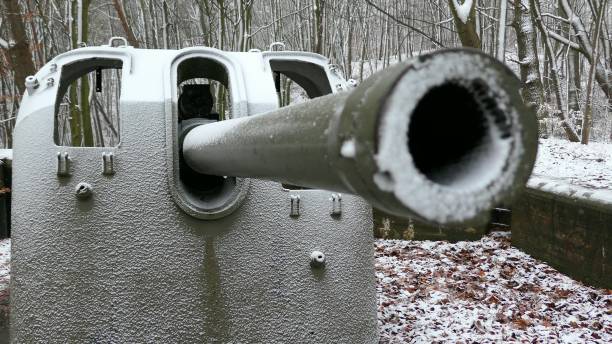 Rotating Artillery Cannon in Winter Forest During Snowfall