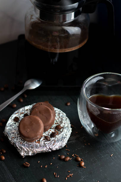 Coffee in a glass cup with chocolate baking.