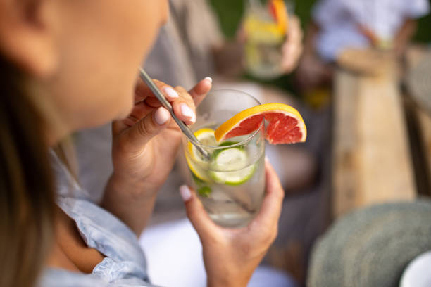 istock People drinking juice and having fun outoors 1667605591