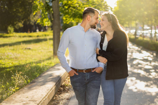 istock Couple romantic walking in city park 1667606108