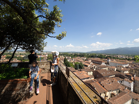 Lucca, Italy - July 02 2023: On top of the Guinigi tower. The tower dates from the 1300. Lucca is a city in Tuscany.