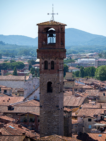 Lucca, Italy - July 02 2023: City view from the Guinigi tower. Lucca is a city in Tuscany. It is known as Città d'arte (City of Art) from its intact Renaissance-era city walls.