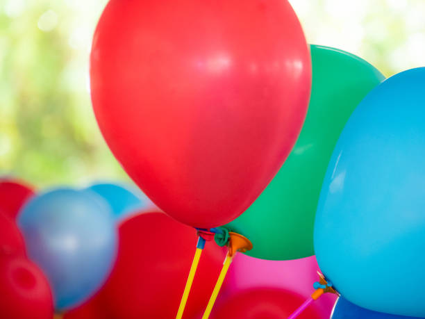 istock Colorful balloons with happy celebration party background. 1667615616