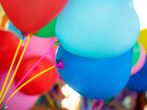 Bunch of colorful balloons on background. Close-up image of the bright colored balloons.