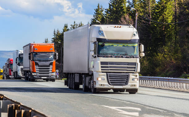 istock Trucks moving on country road 1667645685